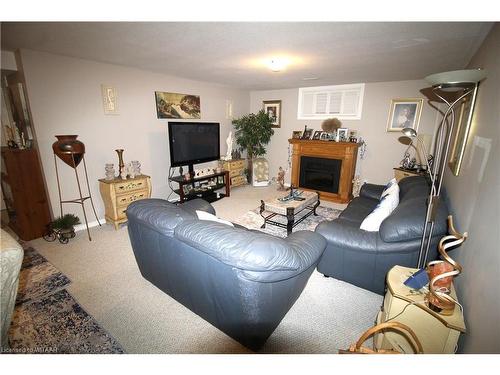 5-150 Oak Street, Simcoe, ON - Indoor Photo Showing Living Room With Fireplace