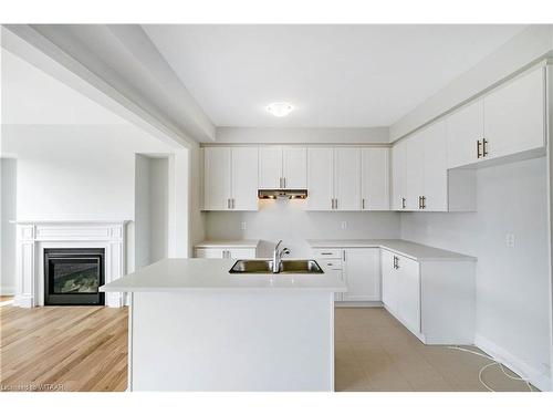 255 Harwood Avenue, Woodstock, ON - Indoor Photo Showing Kitchen With Fireplace