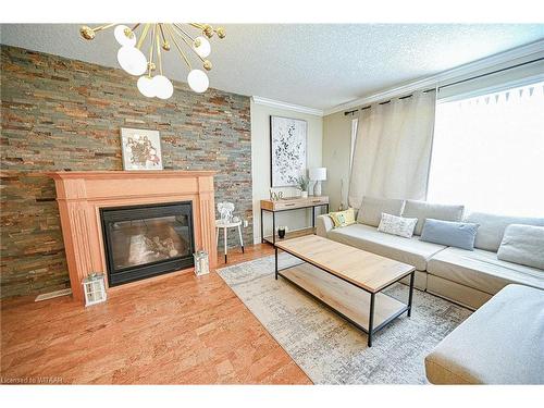 905 Woodbine Court, Kitchener, ON - Indoor Photo Showing Living Room With Fireplace