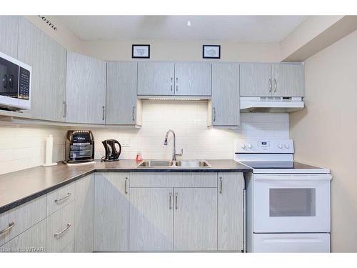 112-163 Ferguson Drive, Woodstock, ON - Indoor Photo Showing Kitchen With Double Sink