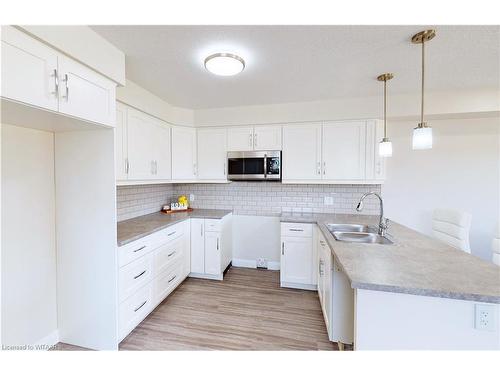 A-137 Wimpole Street, Mitchell, ON - Indoor Photo Showing Kitchen With Double Sink