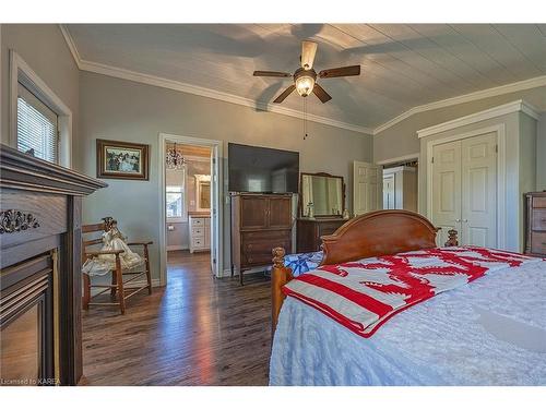 262 Hickey Lane, Tichborne, ON - Indoor Photo Showing Bedroom With Fireplace