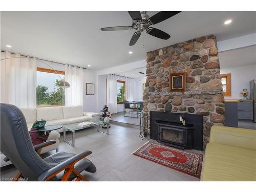 965 Baseline Road, Wolfe Island, ON - Indoor Photo Showing Living Room With Fireplace