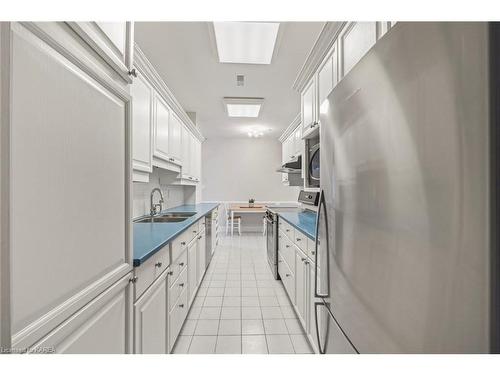 305-20 Gore Street, Kingston, ON - Indoor Photo Showing Kitchen With Double Sink