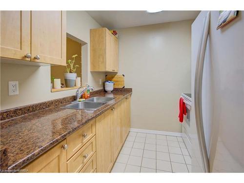 107-573 Armstrong Road, Kingston, ON - Indoor Photo Showing Kitchen With Double Sink