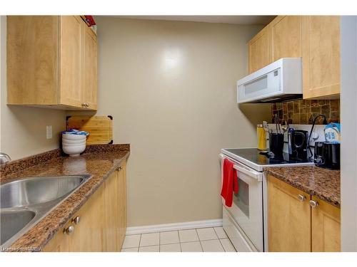 107-573 Armstrong Road, Kingston, ON - Indoor Photo Showing Kitchen With Double Sink