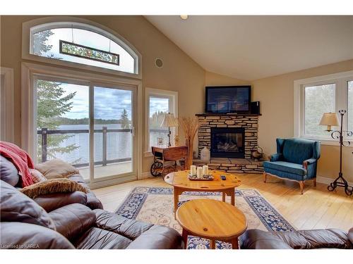 2000 Brewer Road, Sharbot Lake, ON - Indoor Photo Showing Living Room With Fireplace