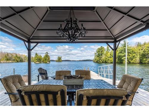 1604 Shibley Road, Sharbot Lake, ON - Outdoor With Body Of Water With Deck Patio Veranda With Exterior