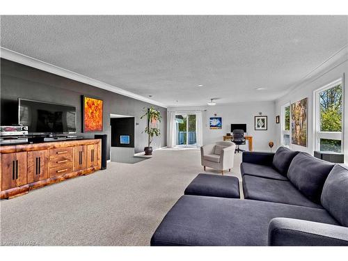 3 Thunderbird Circle, Kingston, ON - Indoor Photo Showing Living Room With Fireplace