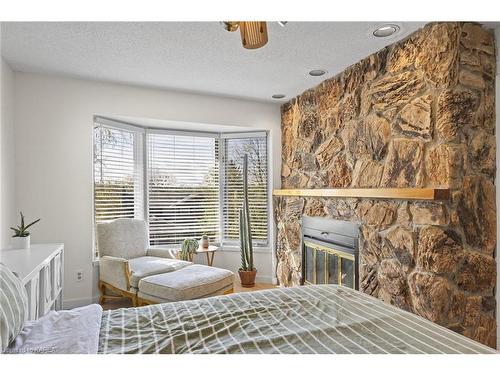 61 Limeridge Drive, Kingston, ON - Indoor Photo Showing Bedroom With Fireplace