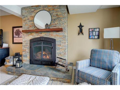 201 Colebrook Road, Yarker, ON - Indoor Photo Showing Living Room With Fireplace