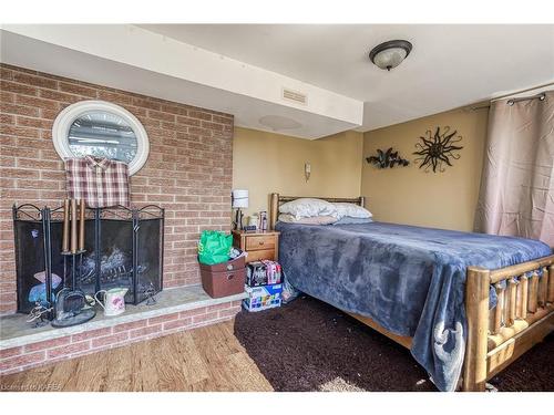 3 Sharmans Lane, Kingston, ON - Indoor Photo Showing Bedroom With Fireplace