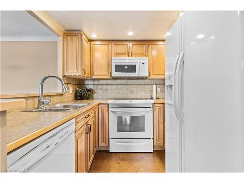 708-120 Barrett Court, Kingston, ON - Indoor Photo Showing Kitchen With Double Sink