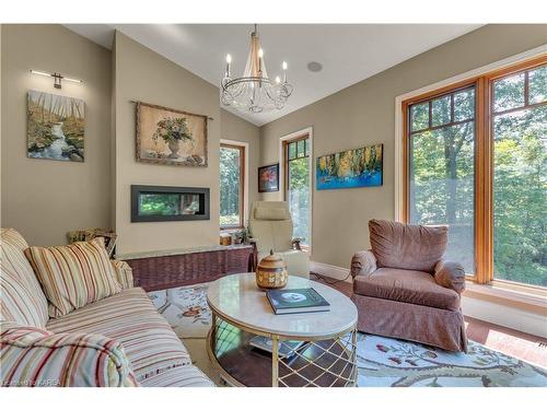 7955 Perth Road, South Frontenac, ON - Indoor Photo Showing Living Room With Fireplace