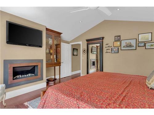 7955 Perth Road, South Frontenac, ON - Indoor Photo Showing Bedroom With Fireplace