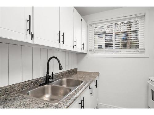 106-835 Milford Drive, Kingston, ON - Indoor Photo Showing Kitchen With Double Sink