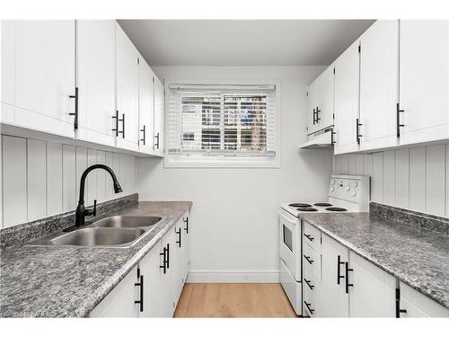 106-835 Milford Drive, Kingston, ON - Indoor Photo Showing Kitchen With Double Sink