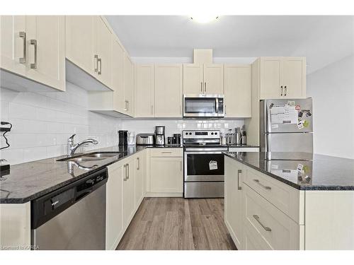 103-1005 Terra Verde Way, Kingston, ON - Indoor Photo Showing Kitchen With Double Sink