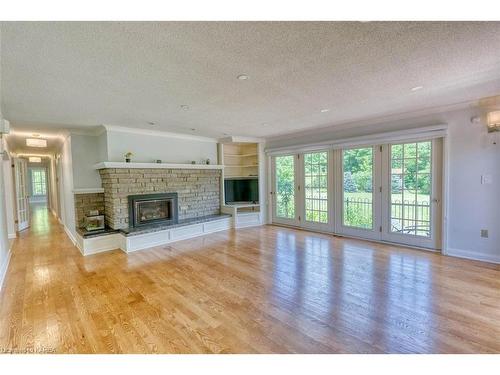 13382 Road 38 Road, Sharbot Lake, ON - Indoor Photo Showing Living Room With Fireplace