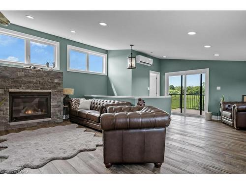 1610 County Rd 15, Picton, ON - Indoor Photo Showing Living Room With Fireplace