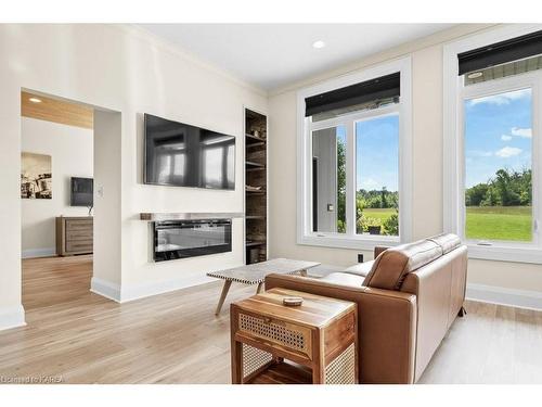 1610 County Rd 15, Picton, ON - Indoor Photo Showing Living Room With Fireplace