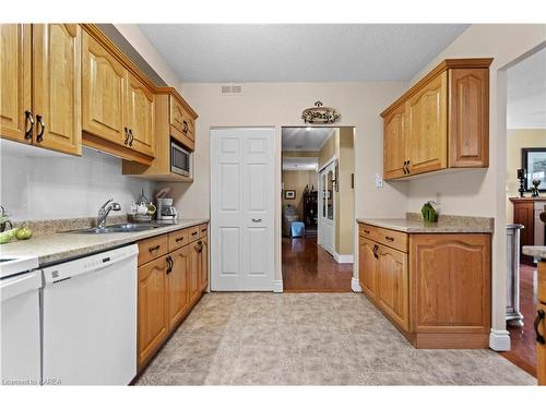 402-1000 King Street W, Kingston, ON - Indoor Photo Showing Kitchen With Double Sink