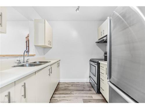 207-566 Armstrong Road, Kingston, ON - Indoor Photo Showing Kitchen With Double Sink