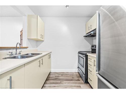 207-566 Armstrong Road, Kingston, ON - Indoor Photo Showing Kitchen With Double Sink