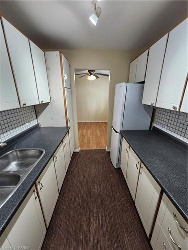 108-835 Milford Drive, Kingston, ON - Indoor Photo Showing Kitchen With Double Sink