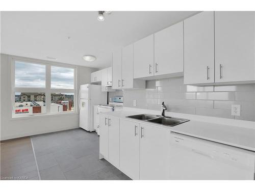 406-1080 Terra Verde Way, Kingston, ON - Indoor Photo Showing Kitchen With Double Sink