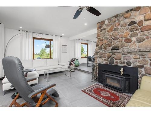 965 Baseline Road, Wolfe Island, ON - Indoor Photo Showing Living Room With Fireplace