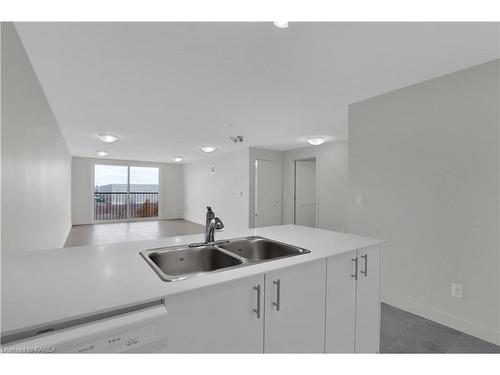 310-1080 Terra Verde Way, Kingston, ON - Indoor Photo Showing Kitchen With Double Sink