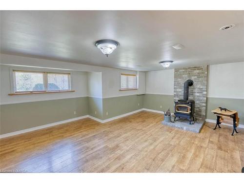 1154 Village Woods Drive, Sharbot Lake, ON - Indoor Photo Showing Other Room With Fireplace