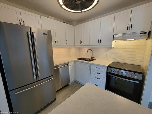 304-120 Barrett Court, Kingston, ON - Indoor Photo Showing Kitchen With Double Sink