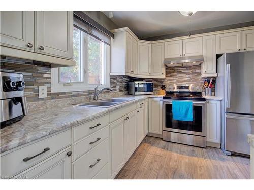 67-22 Coventry Crescent, Kingston, ON - Indoor Photo Showing Kitchen With Double Sink