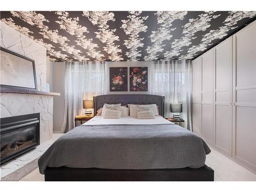 784 Downing Street, Kingston, ON - Indoor Photo Showing Bedroom With Fireplace