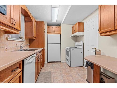 304-257 Bath Road, Kingston, ON - Indoor Photo Showing Kitchen With Double Sink