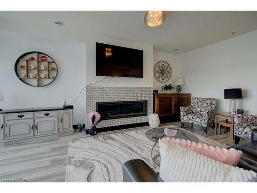 308-130 Water Street Street, Gananoque, ON - Indoor Photo Showing Living Room With Fireplace