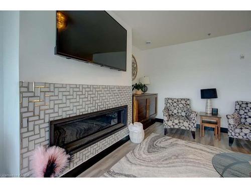 308-130 Water Street Street, Gananoque, ON - Indoor Photo Showing Living Room With Fireplace