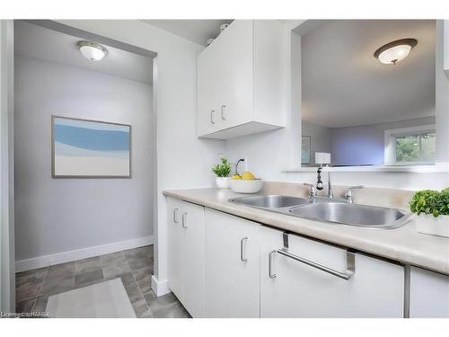 118-580 Armstrong Road, Kingston, ON - Indoor Photo Showing Kitchen With Double Sink