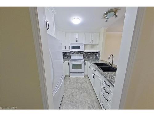 102-7 Centre Street, Napanee, ON - Indoor Photo Showing Kitchen With Double Sink