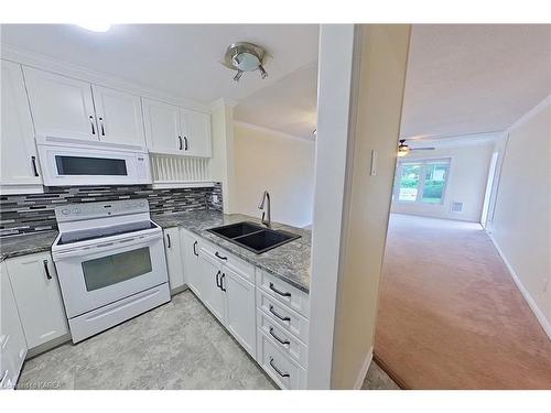 102-7 Centre Street, Napanee, ON - Indoor Photo Showing Kitchen With Double Sink