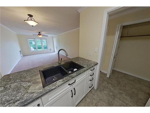 102-7 Centre Street, Napanee, ON - Indoor Photo Showing Kitchen With Double Sink