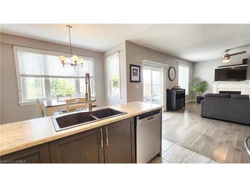 156 Mcdonough Crescent, Amherstview, ON - Indoor Photo Showing Kitchen With Fireplace With Double Sink