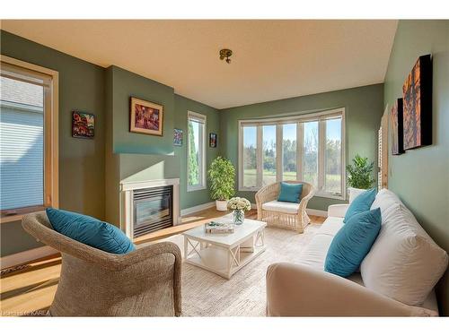 44 Country Club Drive, Bath, ON - Indoor Photo Showing Living Room With Fireplace