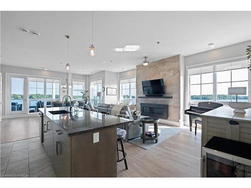 501-130 Water Street, Gananoque, ON - Indoor Photo Showing Kitchen With Fireplace With Upgraded Kitchen