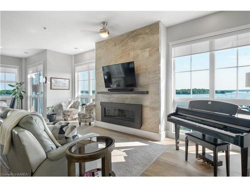 501-130 Water Street, Gananoque, ON - Indoor Photo Showing Living Room With Fireplace