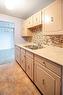 410-334 Queen Mary Road, Kingston, ON  - Indoor Photo Showing Kitchen With Double Sink 