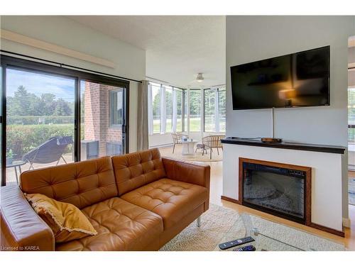 102-1000 King Street W, Kingston, ON - Indoor Photo Showing Living Room With Fireplace