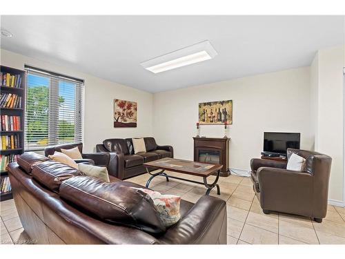 114-358 Queen Mary Road, Kingston, ON - Indoor Photo Showing Living Room With Fireplace